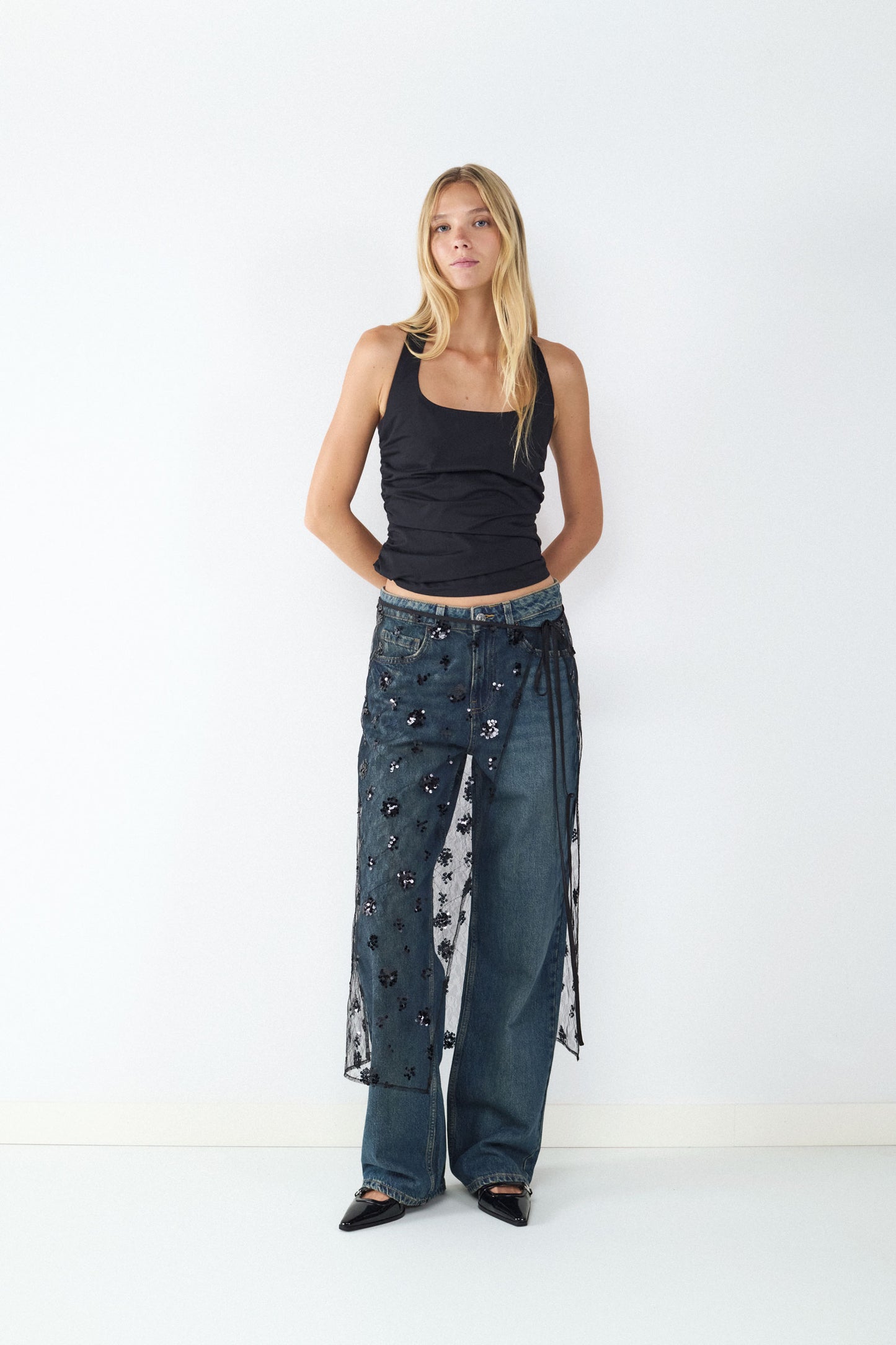 FALDA MIDI TRANSPARENTE LENTEJUELAS