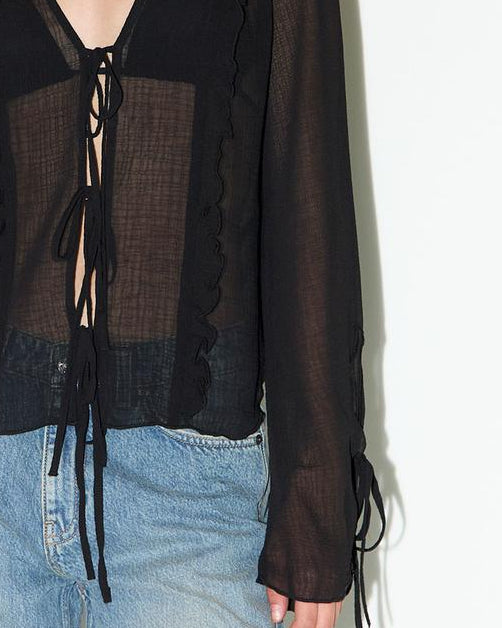 Blusa semitransparente con lazadas