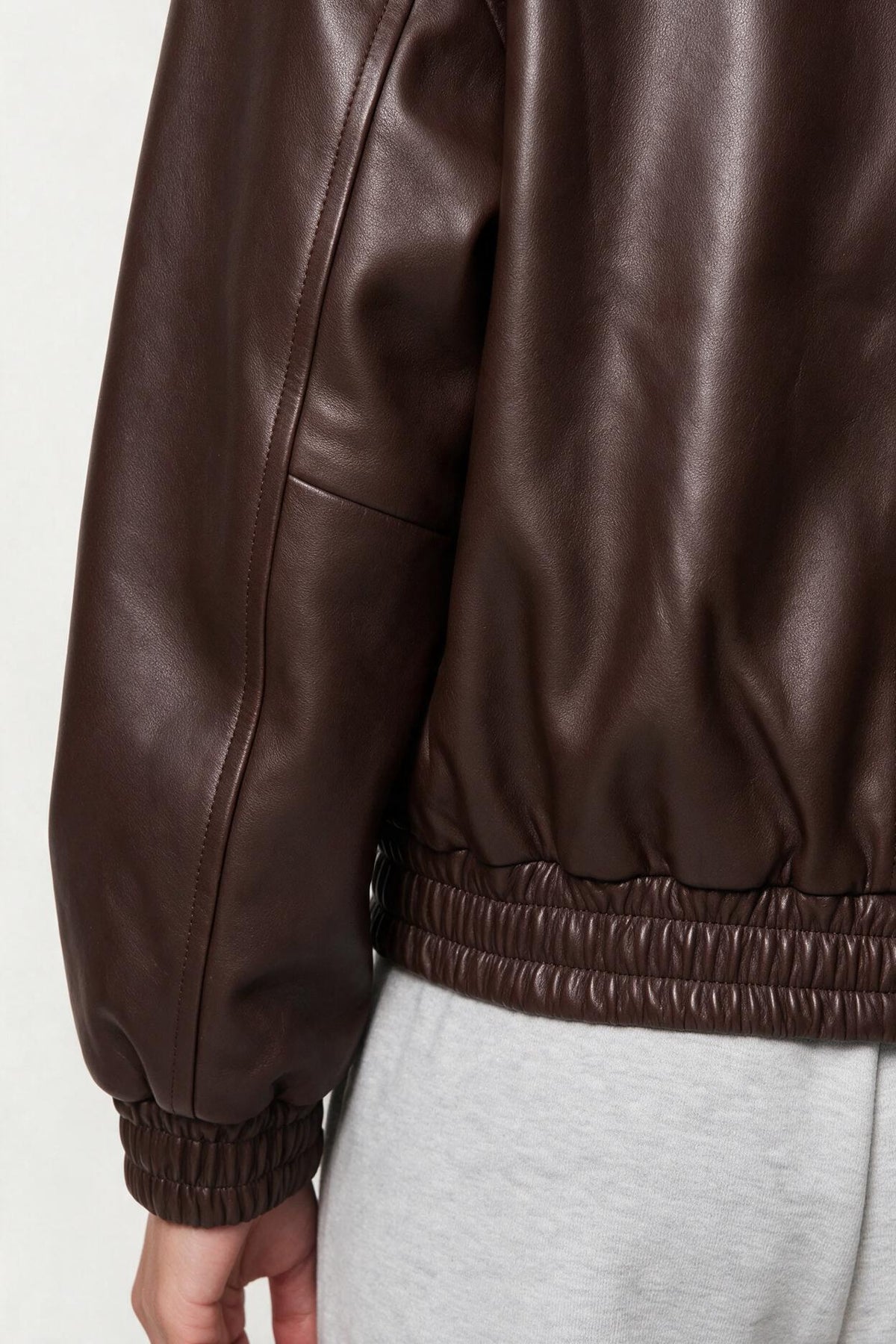 Faux leather jacket with elasticated hem