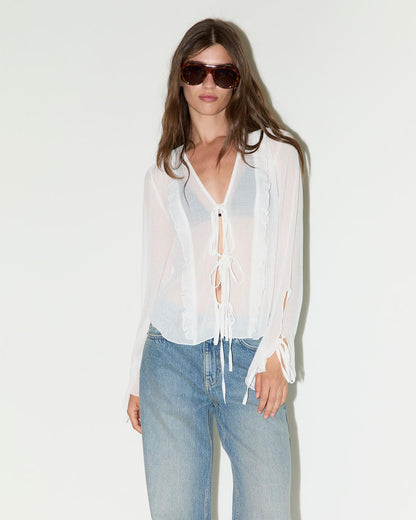 BLUSA SEMITRANSPARENTE CON LAZADAS
