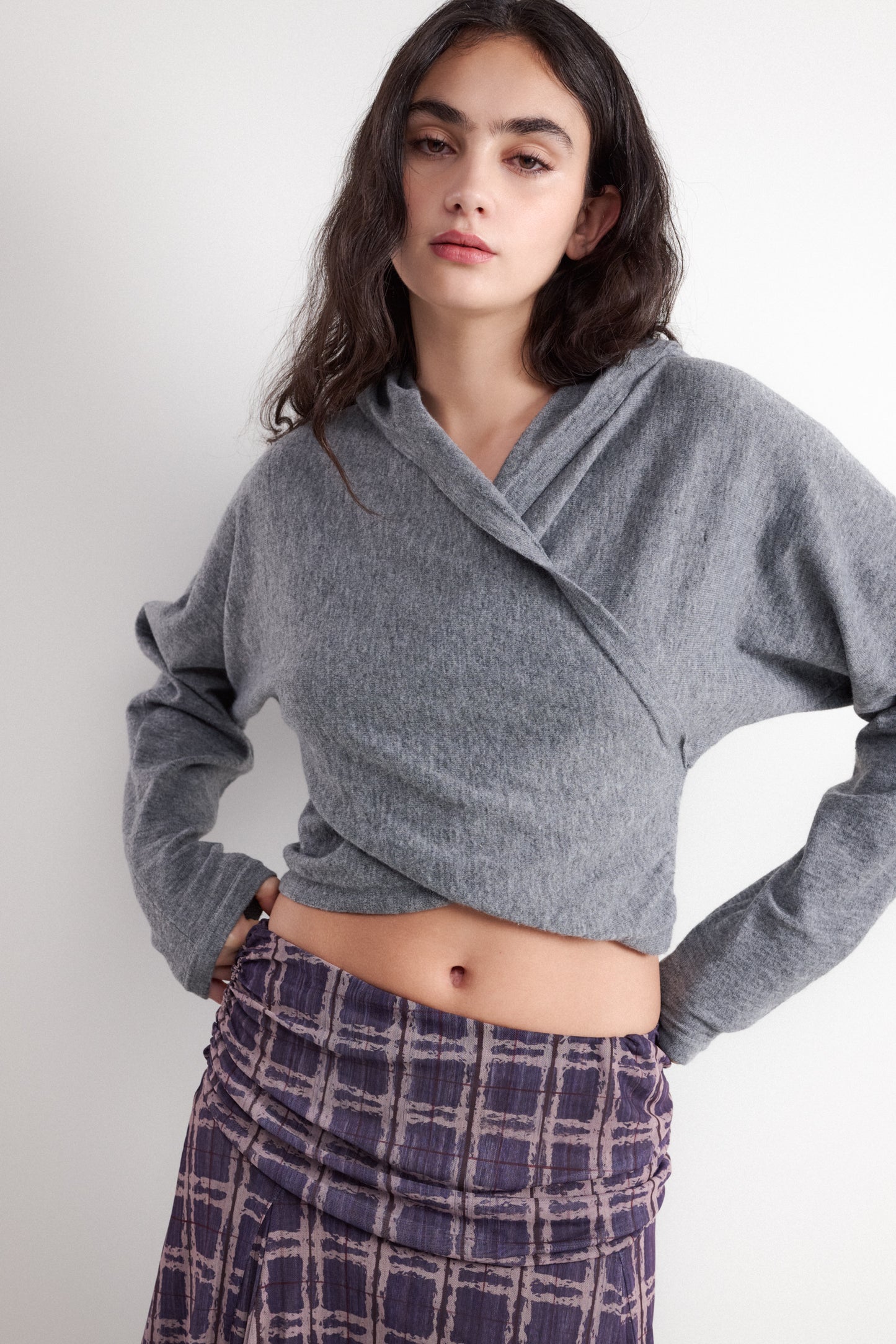 Crossover style hooded sweater