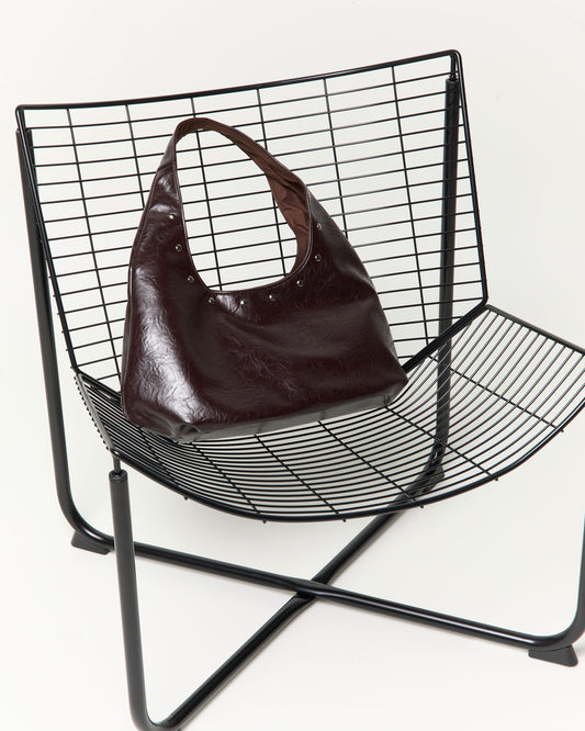 Bolso hobo efecto piel con tachas